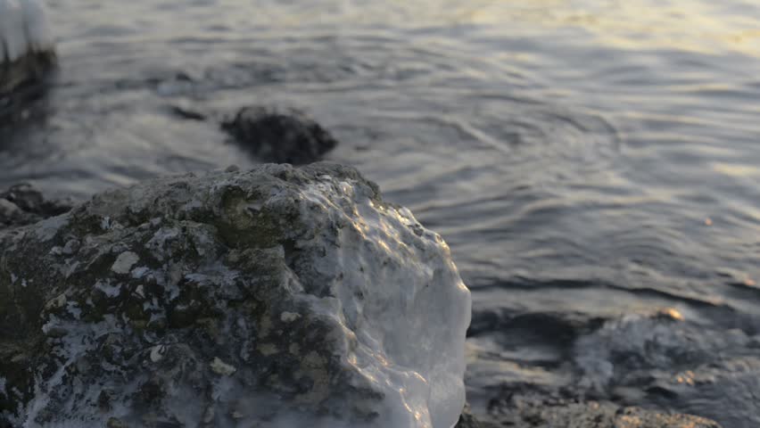 frozen breakwater stones in the area of the city of Varna, Bulgaria by the Black Sea coast. 