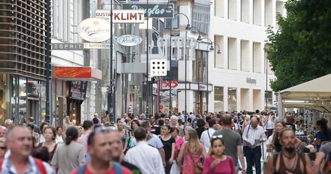 VIENNA, AUSTRIA - JULY 16, 2014 Vienna Establishing Shot Rush Hour Busy People Walk on Shopping Street City Center Shop ( Ultra High Definition, UltraHD, Ultra HD, UHD, 4K, 2160P, 4096x2160 )