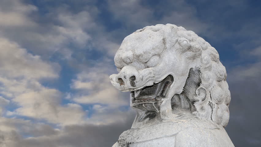 Stone Guardian Lion Statue in Beihai Park -- is an imperial garden to the northwest of the Forbidden City in Beijing, China 
