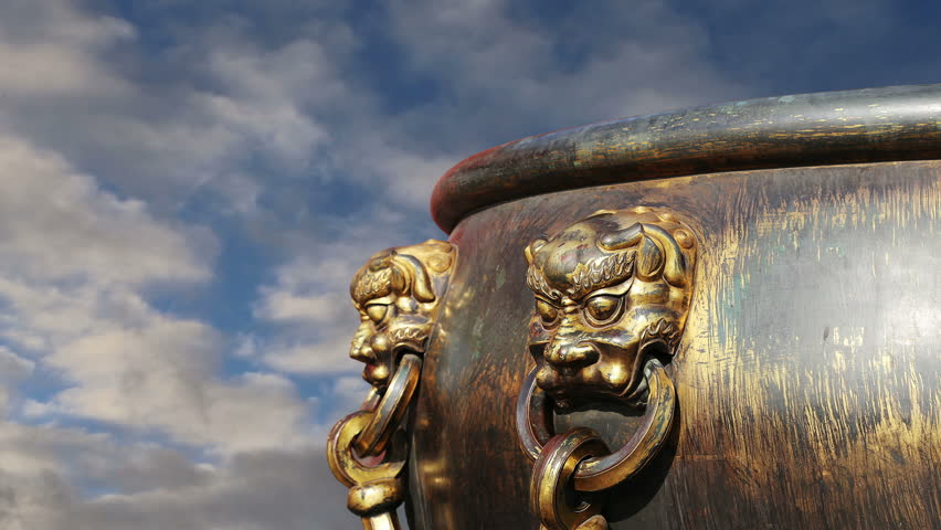 Large bronze bowl to extinguish fire with image Chinese dragon statue in the Forbidden City. Beijing, China  