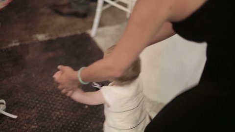 Mom teaches a child to walk