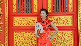 Woman in red dress, Cheongsam dress of Chinese traditional.