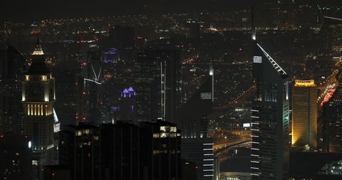 DUBAI, UAE - JANUARY 22, 2014 Illuminated Aerial View Dubai Skyline Emirates Towers Night Lights Business Area ( Ultra High Definition, UltraHD, Ultra HD, UHD, 4K, 2160P, 4096x2160 )