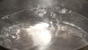 Close-up View of Boiling Water in a Kitchen Pot. 4K Ultra HD 3840x2160 Video Clip  