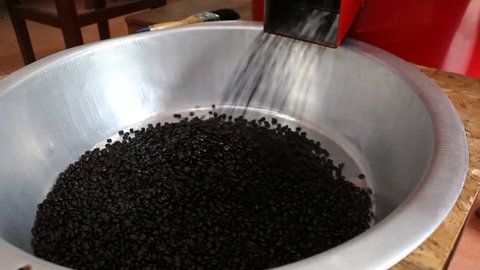 Roasted beans pour out of machine