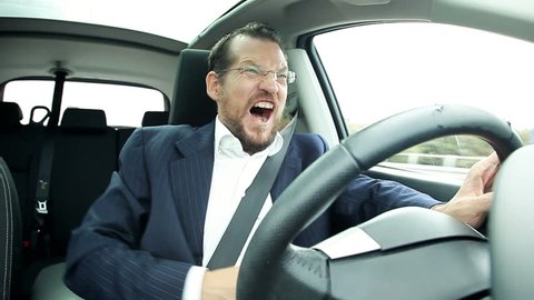 Business man driving car feeling stomach sick funny faces