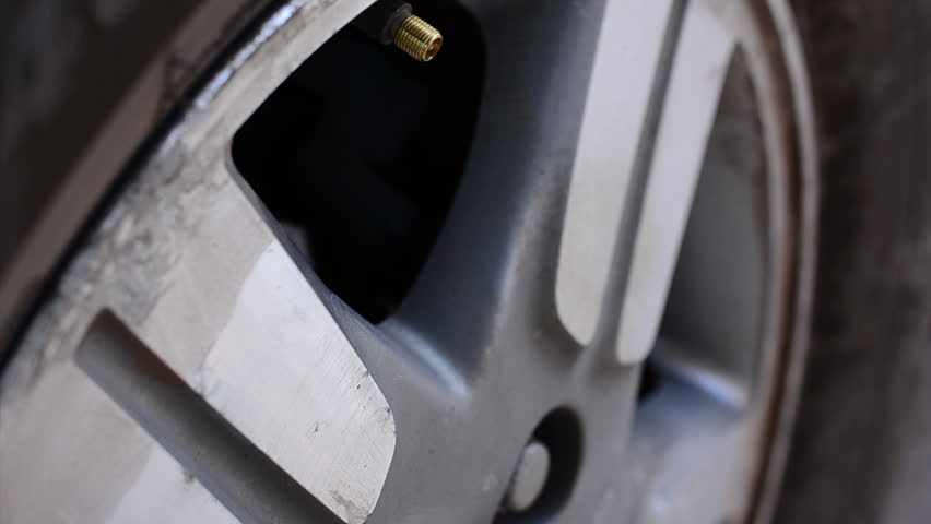 HD: Close up Check the tire pressure | Shutterstock HD Video #8558176