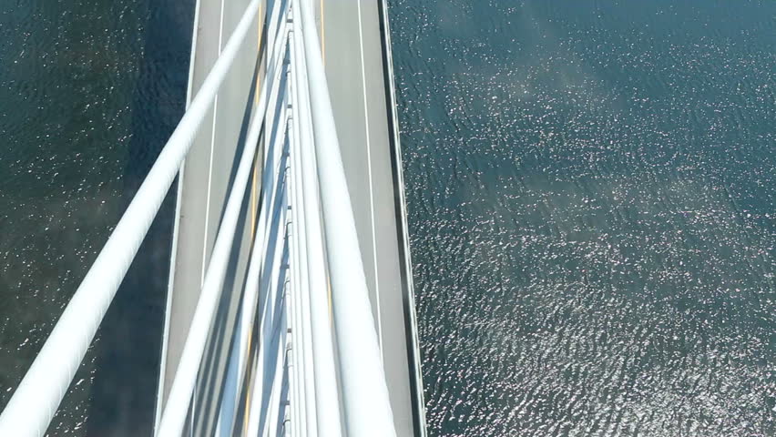 A unique view of a suspension bridge with traffic.  