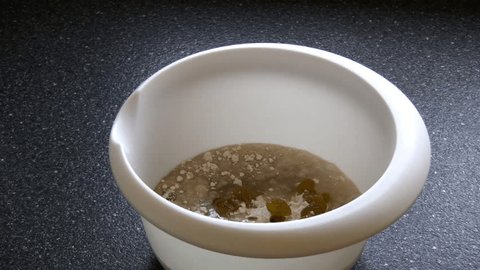 Mixing A Cake Batter In A Bowl With A Wooden Spoon