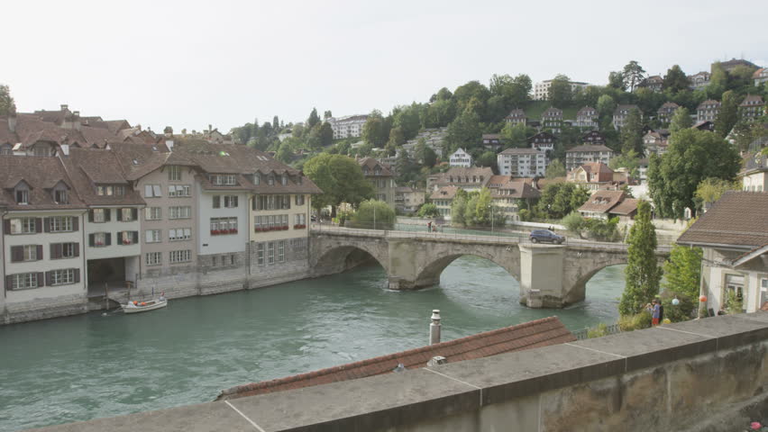 Woman taking photograph picture in Bern with smart phone walking in Bern, Switzerland. Travel concept with multicultural Asian Caucasian girl. RED EPIC 60 FPS SLOW MOTION.