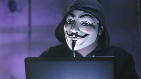 NEW YORK - JAN 19: Anonymous computer hacker wearing Guy Fawkes vendetta mask on January 19, 2015. 