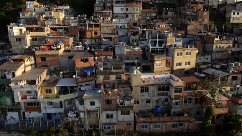 Favela Aerials: Slow move up favela mountainside houses in Rio de Janeiro, Brazil