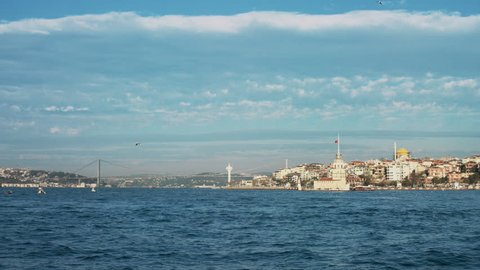 4K slow motion shot of Maiden's Tower in Istanbul Bosphorus bridge at the background.