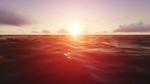 Beautiful sunset or sunrise on the ocean. Sun light beam shining through the cloudscape.
