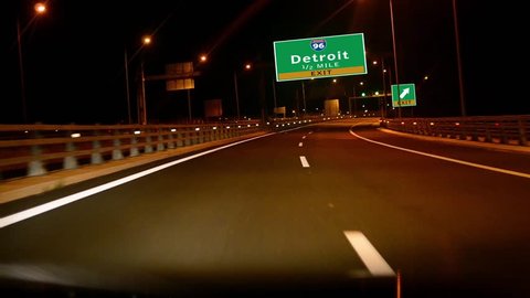 Driving on Highway/interstate at night,  Exit sign of the City Of Detroit, Michigan