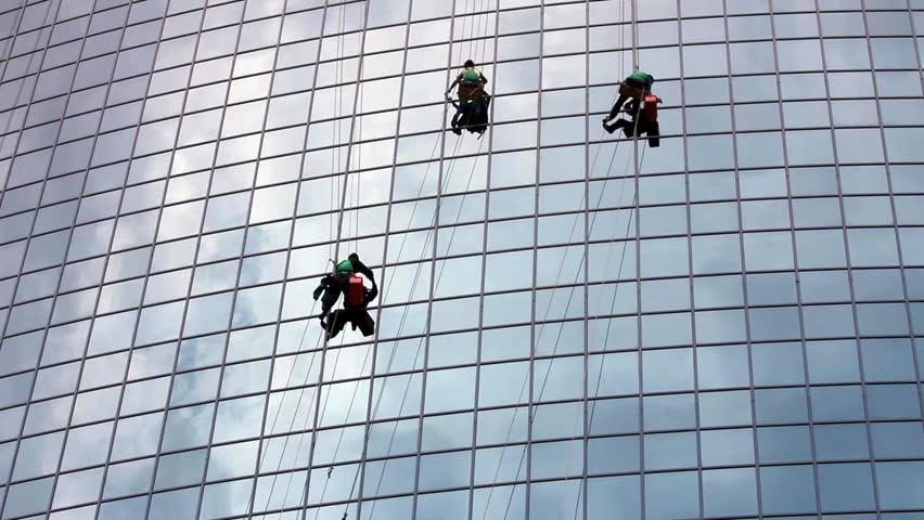window cleaners at work on skyscraper