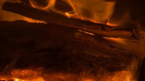 Slow burning logs on fireplace close up 4K 3840X2160 UHD video - Burning fireplace close-up 4K 2160p UHD footage