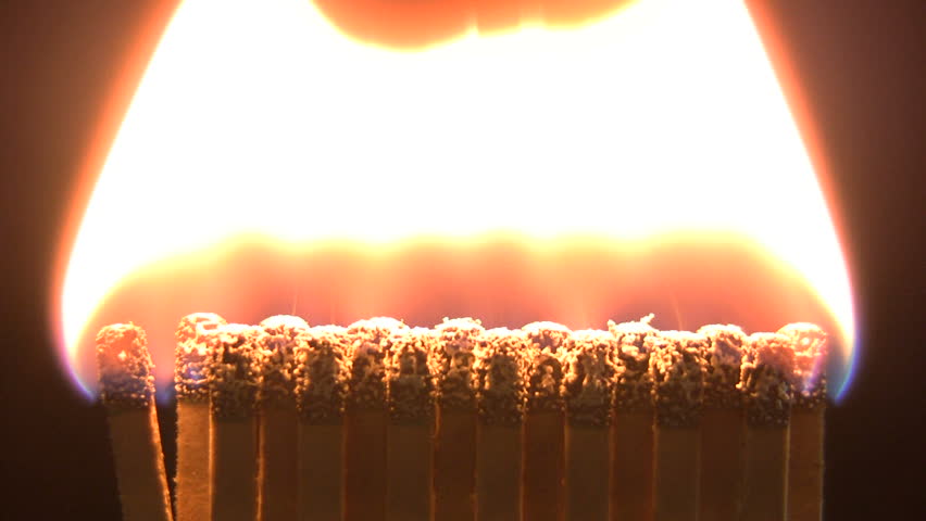 Close up shot of matchbook on fire