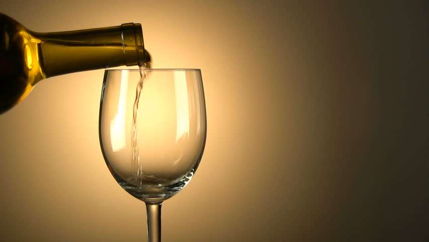 White wine is poured into glass with space for copy