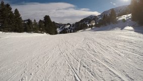 Skier view of the adrenaline downhill skiing in Austrian Alps on a sunny winter day / 3840X2160, 4K video, 30 fps.