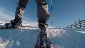 Low angle shot of the downhill skier in Austrian Alps on a sunny winter day / 3840X2160, 4K video, 30 fps.