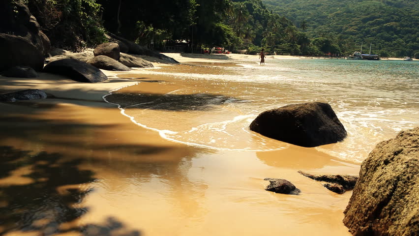 Idyllic paradise beach with green rainforest and turquoise sea 