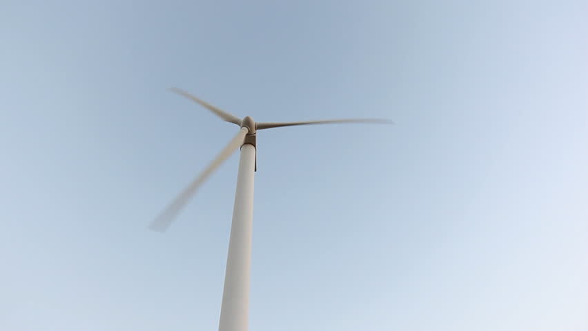 Close up of a wind power machine in three different perspectives 