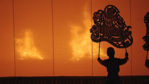 RAJBURI,THAILAND-APRIL 13 2013:The Ramayana Story of Hindu.Culture art shadow play  with big puppet in fire shadow.Call Nang Yai.