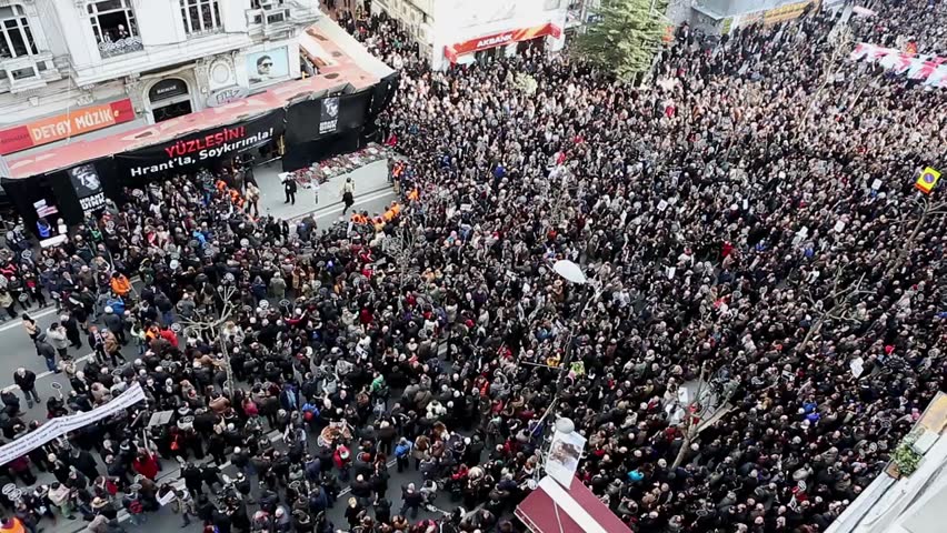ISTANBUL - JANUARY 19: Thousands mark Hrant Dinks death 7 years on. Thousands of protesters walked from Taksim Square to Agos newspaper, on 19 January 2015 in Istanbul,Turkey | Shutterstock HD Video #8611135
