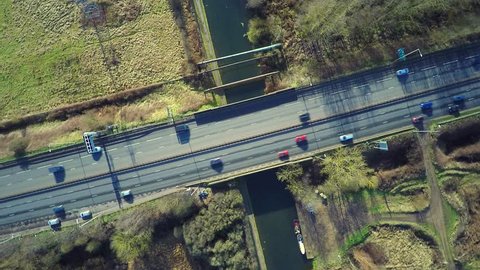 Aerial view of a traffic driving on a motorway  – Stockvideo