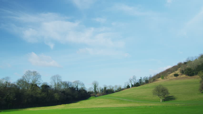 4K Little girl running along a path in slow motion to a playground in the distance, shot on RED EPIC