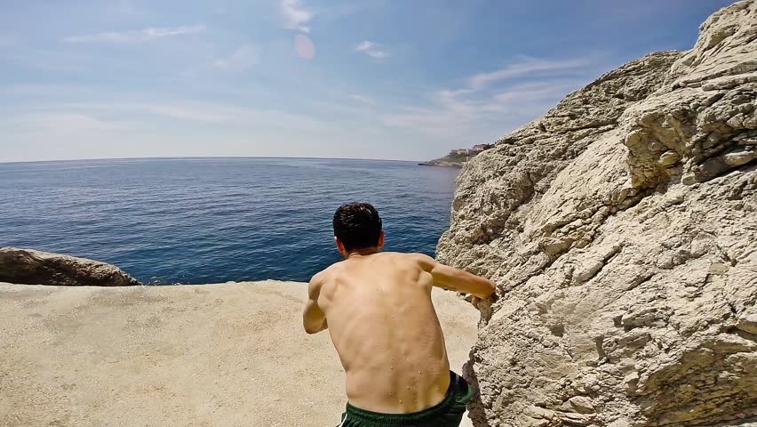 Athletic Young Man Jumping From Cliff Into Ocean Sea Water Muscular Adventure Extreme Sports Lifestyle Hobby Vacation Clear Beach Slow Motion Leisure Activity Gopro HD Royalty-Free Stock Footage #8623765