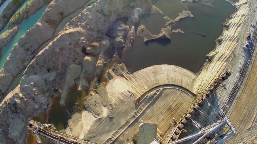 Sandpit with water and absetzer at summer sunny day. Aerial view