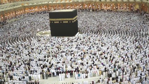 MECCA, SAUDI ARABIA-FEBRUARY 25, 2012: Muslims bow or sujod inside Masjid Haram in Makkah. Muslims all around the world face the Kaaba during prayer time. 