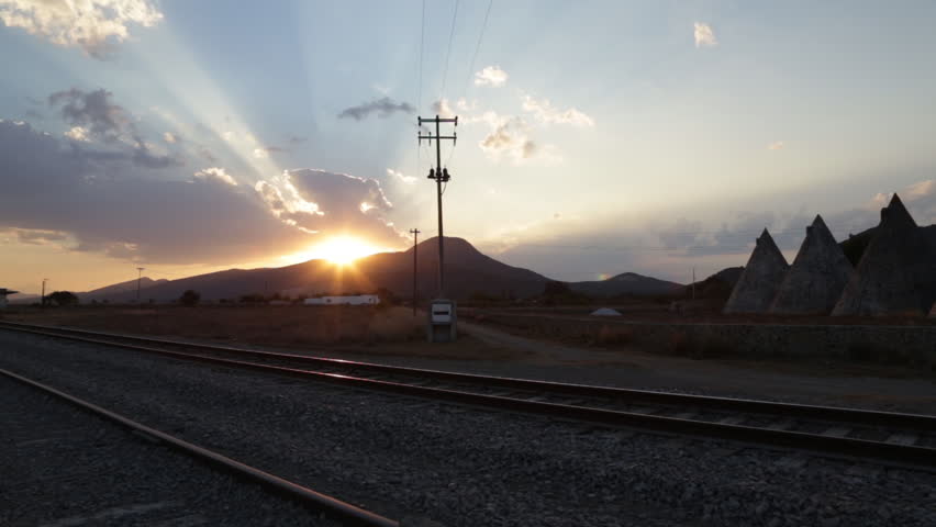 Sunset time-lapse near the train rails.