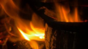 Logs slow burning on fire place close-up long 4K 2160p UHD footage - Fireplace warm fire flame and logs 4K 3840X2160 UHD video