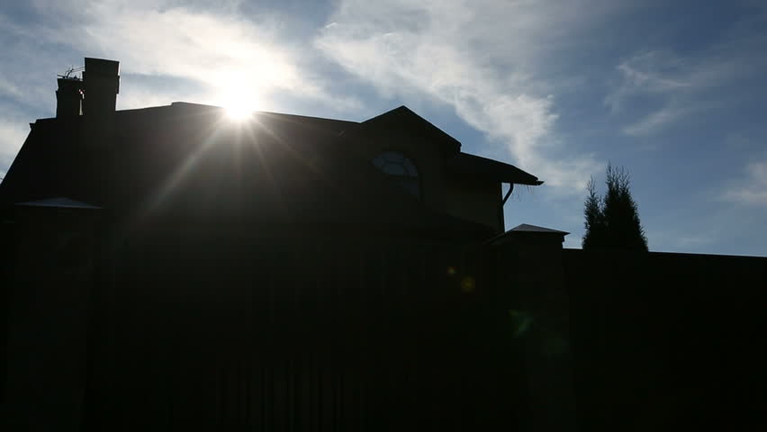 Sunny morning sun over a roof of the big family house. Sequence 2 shot