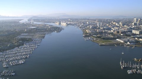 Aerial view Oakland Estuary Yacht vessel Marina commercial Port docks container ships transportation nr San Francisco North America 4K