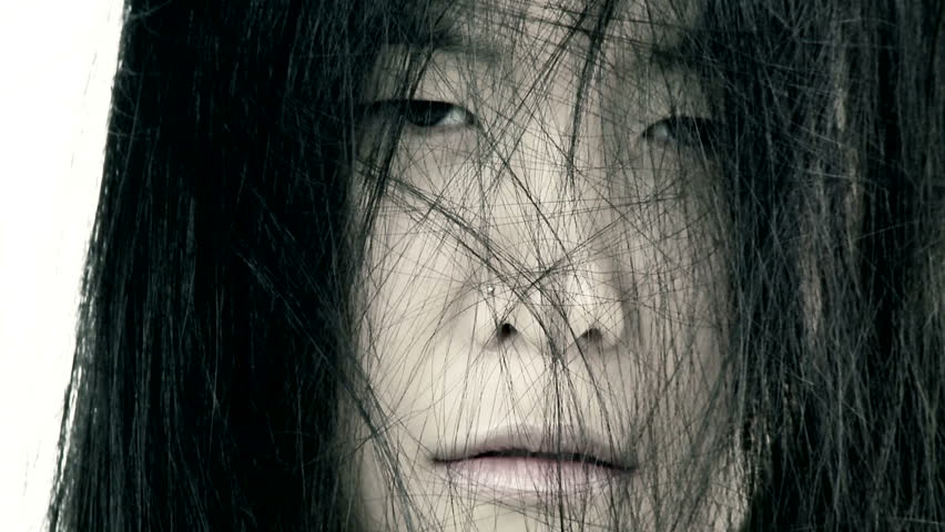 Scary closeup of ugly bad asian woman