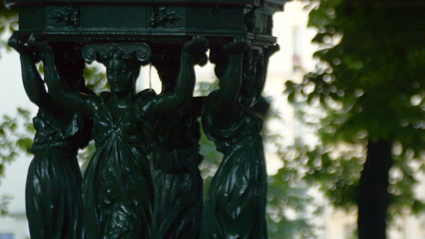 PARIS FRANCE- JULY 2, 2014: Wallace fountains are public drinking fountains designed by Charles-Auguste Lebourg