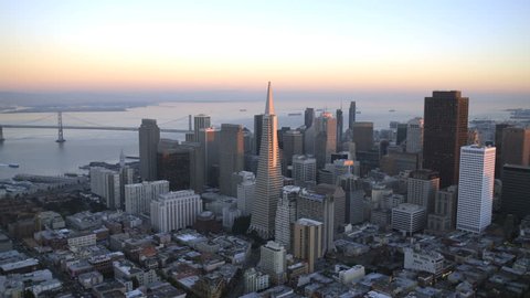 San Francisco - January 2014: Aerial low level sunset view Downtown Transamerica Pyramid building city Skyscrapers San Francisco California USA 4K