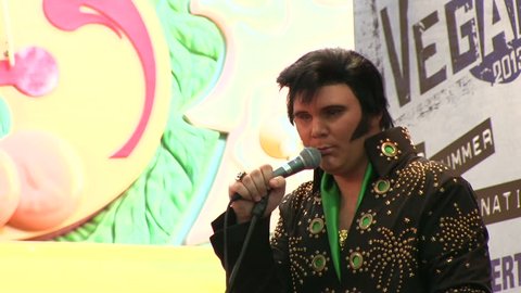 LAS VEGAS, NV - APRIL 22: Elvis singing into microphone on stage of Fremont Street on April 22, 2014 in Las Vegas, Nevada.