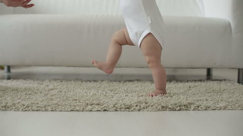 parents teach their child to walk