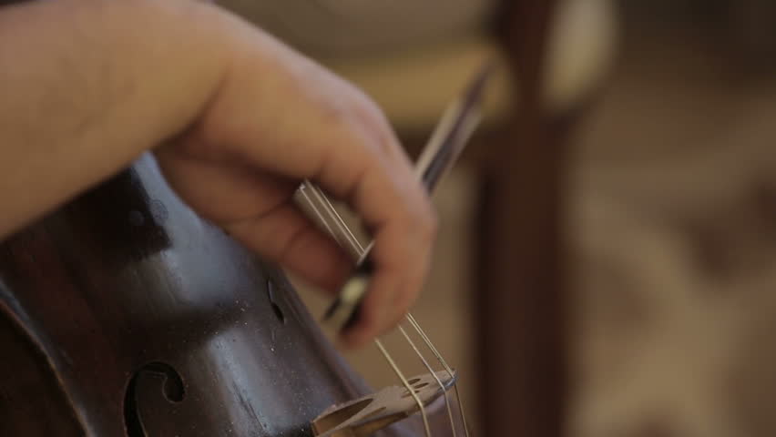 Musician playing violoncello