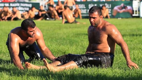ISTANBUL, TURKEY - AUG 24, 2012: Loser oil wrestler. 8th Sile Annual Turkish Oil Wrestling Event. Oil wrestling is a Turkish national sport. 
