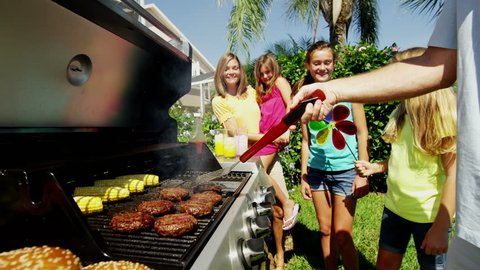Young happy Caucasian family outdoors fresh food barbecue grill modern equipment healthy meat salad beef burger RED EPIC