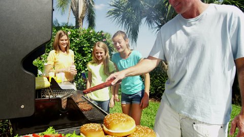 Food nutrition outdoor healthy eating BBQ grill social recreation togetherness Caucasian family mother father female children RED EPIC