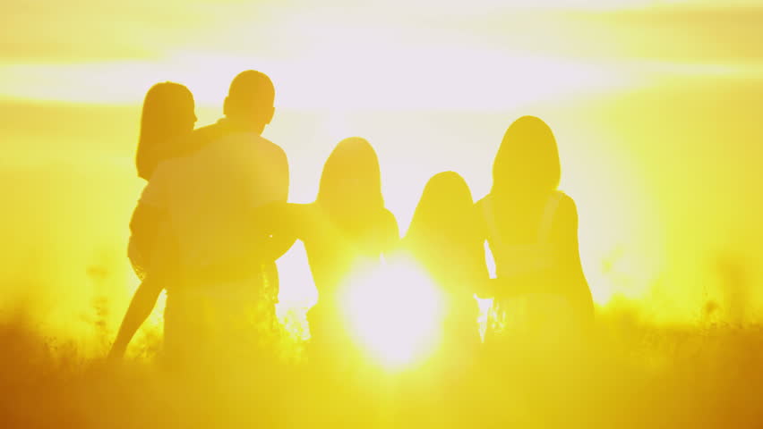 American dream youth relationship Caucasian heterosexual parents girls casual enjoyment meadow growth encouragement outdoors sunset getaway RED EPIC