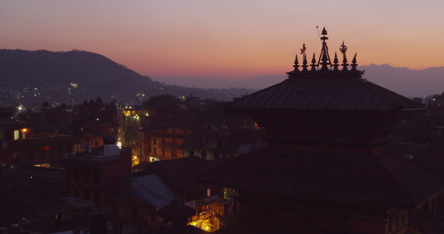 Time lapse of a sunset at Nyatapola Temple and Bhairavnath temple in Bhaktapur, Nepal. The Himalayan Mountain Range can be seen in the distance. Shot on Red Scarlet.