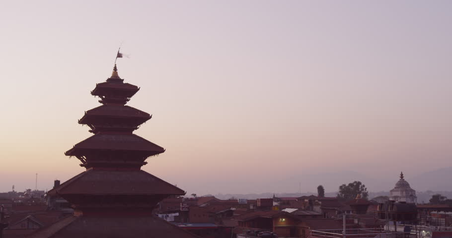 Time lapse of a sunset at Nyatapola Temple and Bhairavnath temple in Bhaktapur, Nepal. The Himalayan Mountain Range can be seen in the distance. Shot on Red Scarlet.